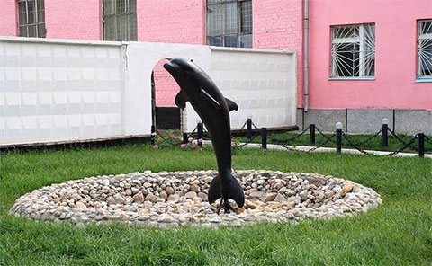Fountain with a black dolphin